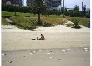 Romina's shot of me after she took the picture of the head. Still note trashed beach.